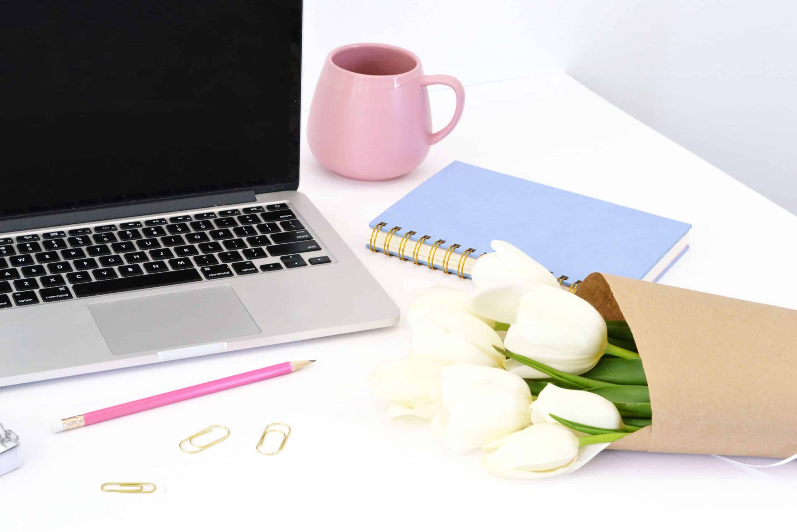 laptop on desk, how many blog posts you should have before launching a blog