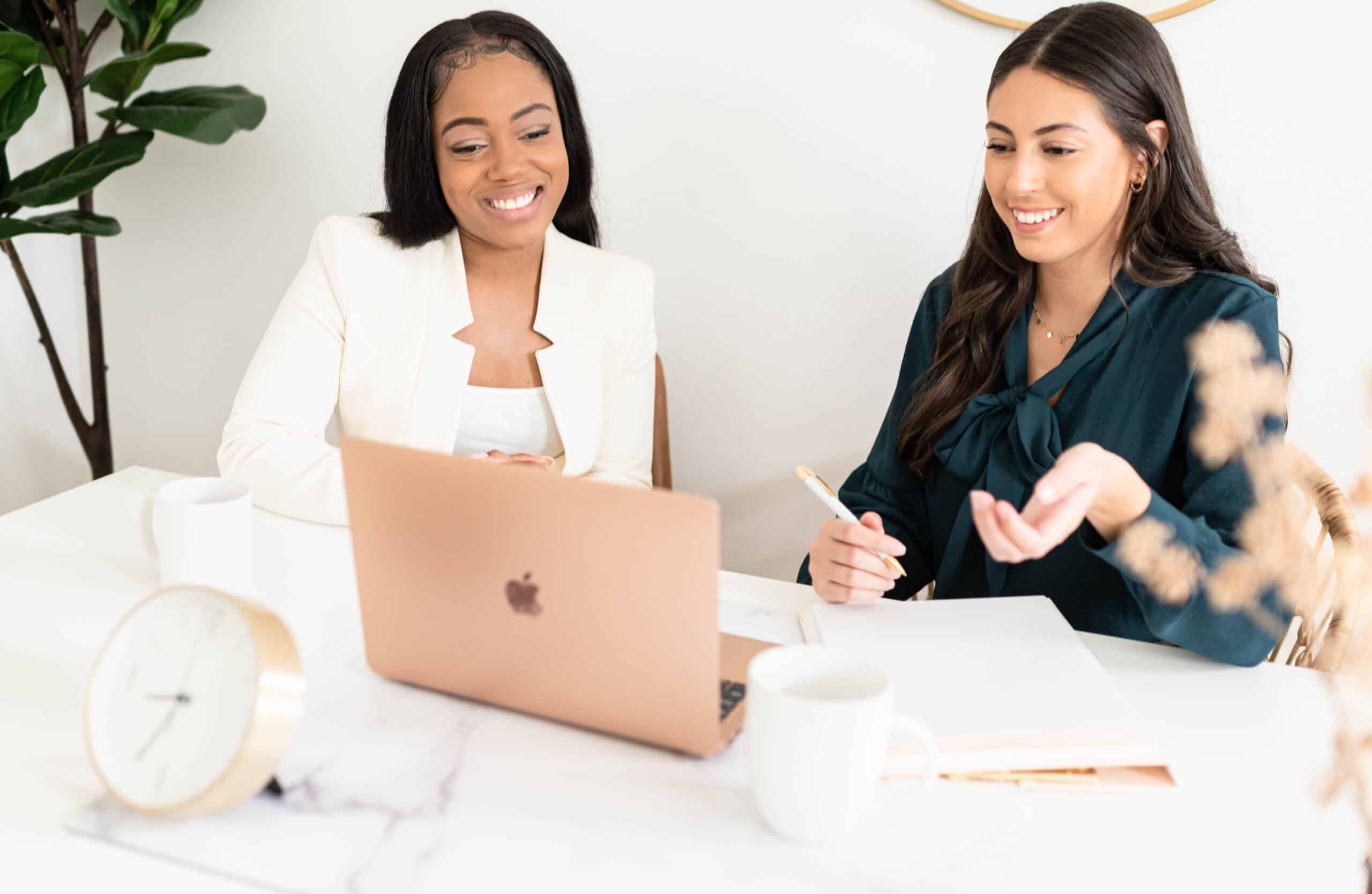 Women discussing business, business name ideas. 